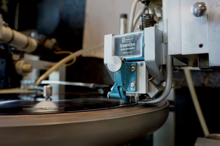 A record disc getting lacquer cut