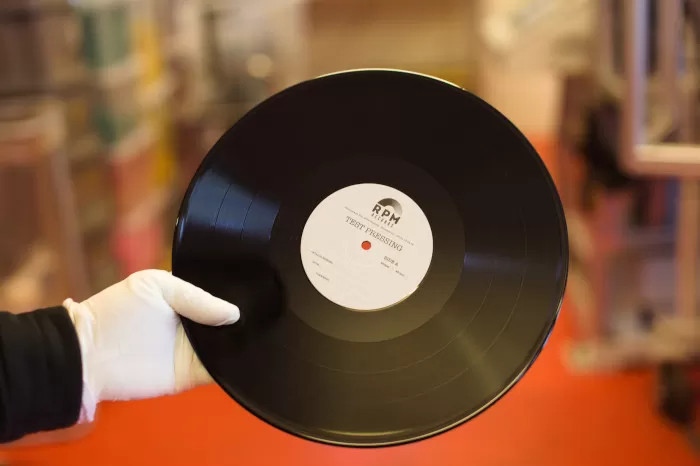 A close-up of an RPM Records test pressing record