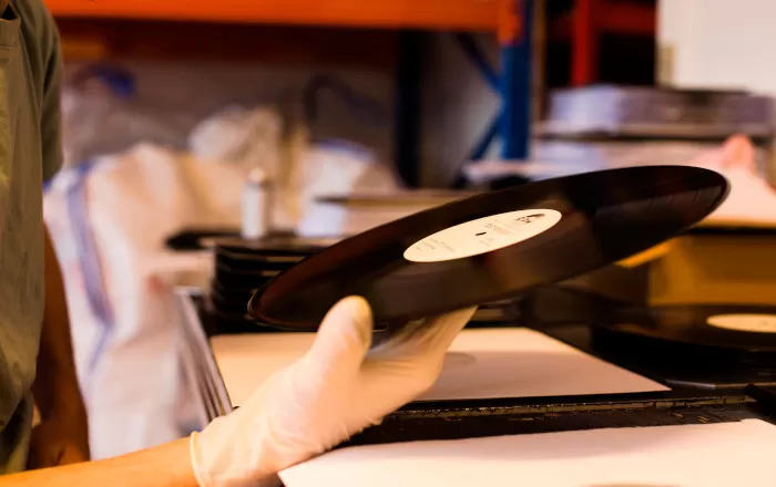 An image of an RPM Records test pressing under quality inspection looking for any physical issues.
