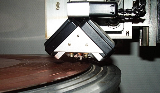 An image of a green vinyl record pressed at RPM Records in Denmark.