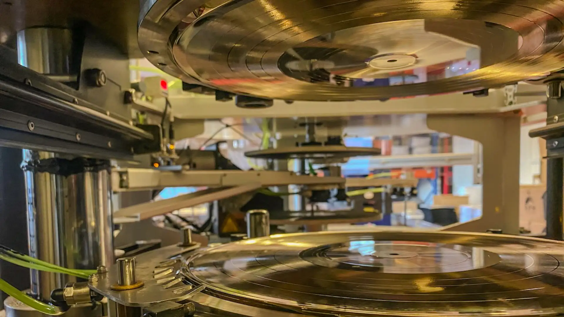 An image of a green vinyl record pressed at RPM Records in Denmark.